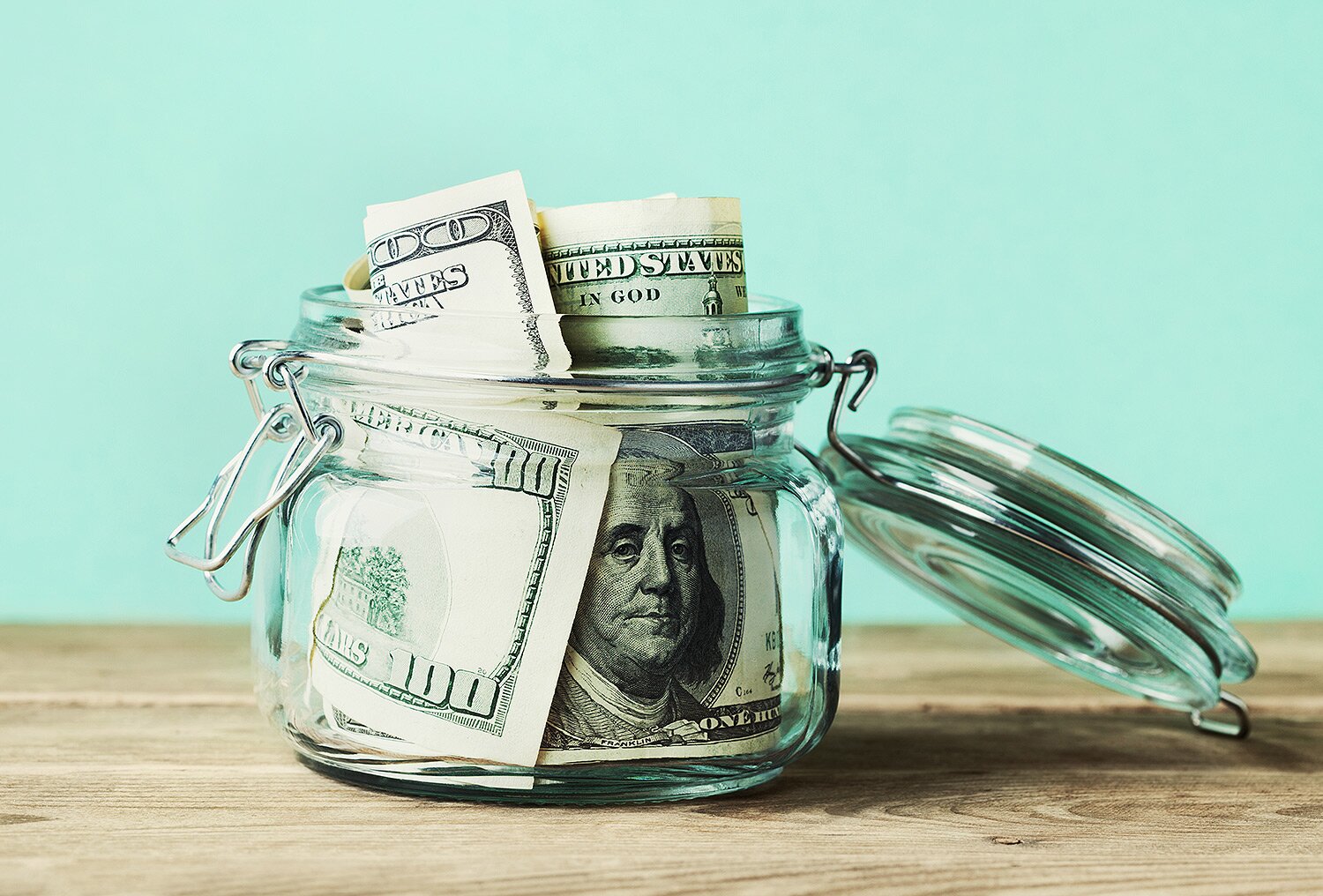 Dollar bills in glass jar