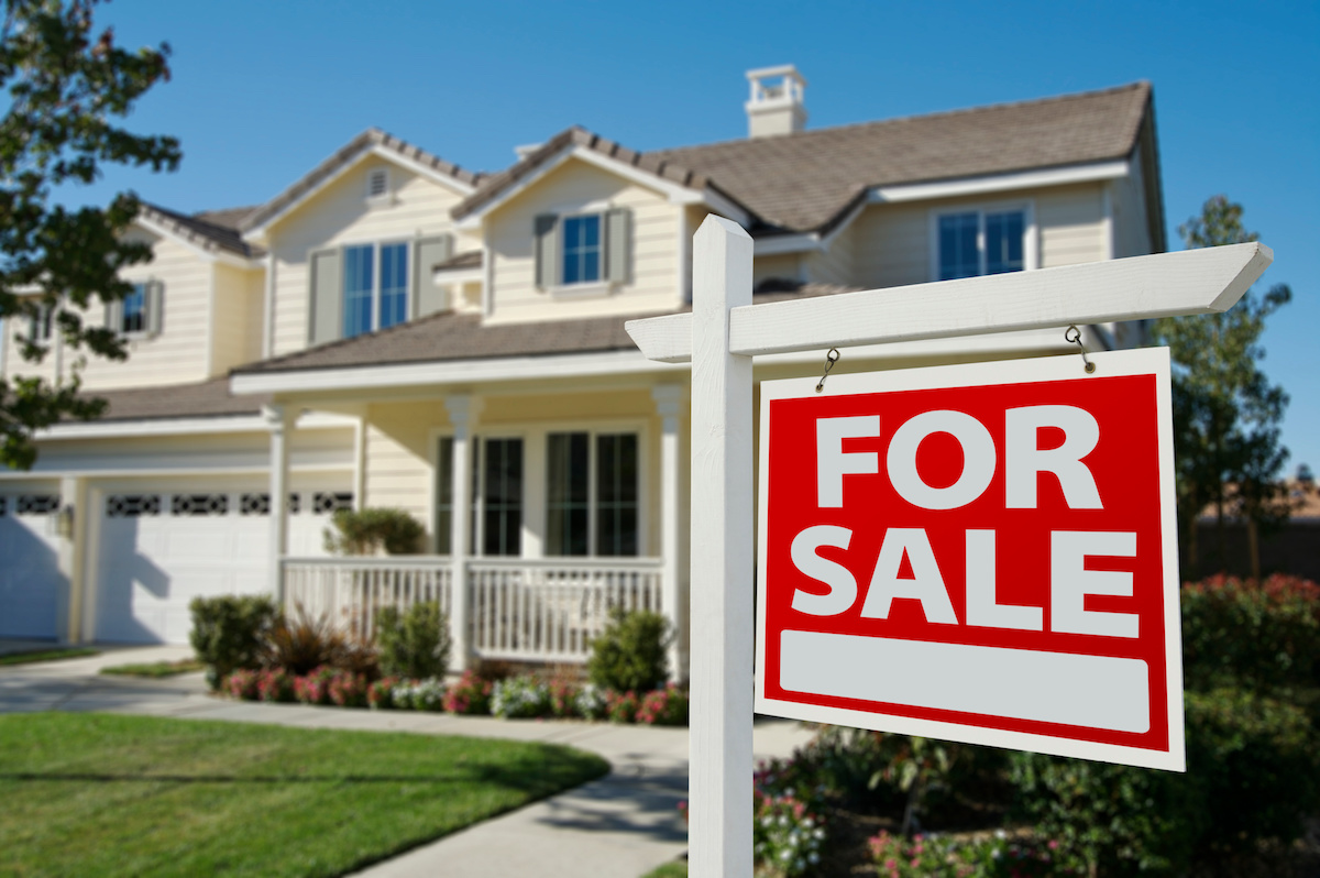 Home For Sale Sign in Front Yard