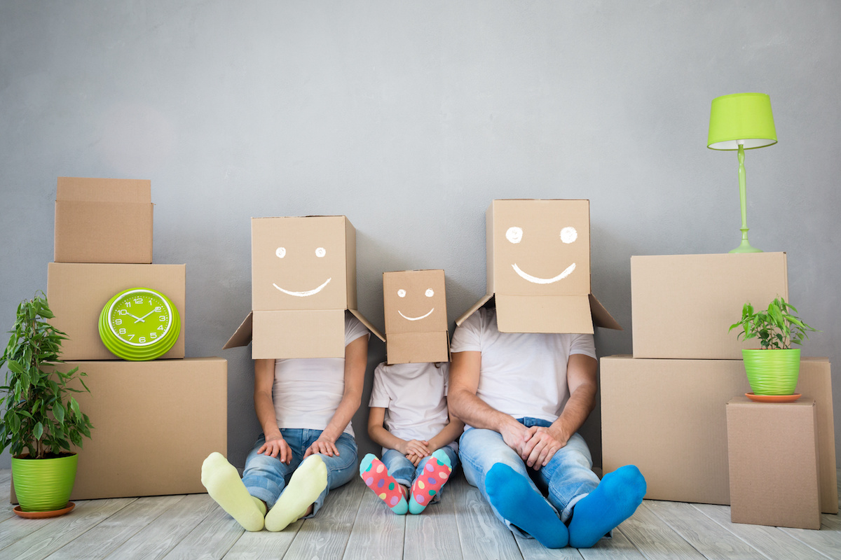 Family with Moving Boxes on Their Heads