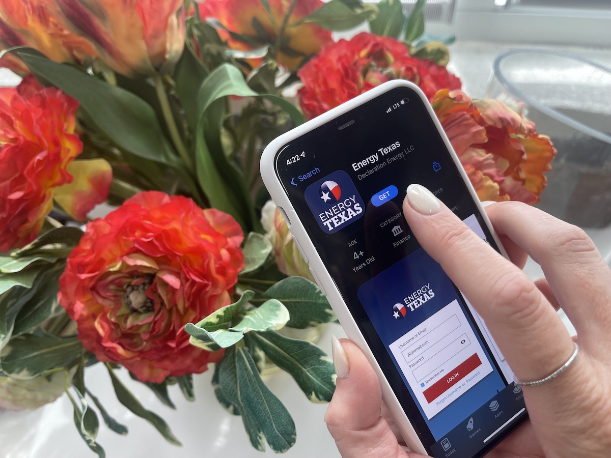 Finger Hovering Above Phone, Energy Texas App